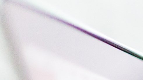 Close up of hands on a laptop keyboard at a desk
