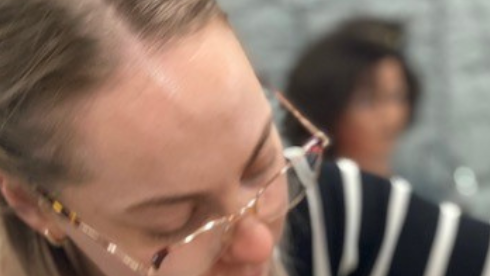 Split image depicting scenes from a hair an make-up training course. On the left, a female student is using a mannequin head to practise her hair braiding technique. On the right, two further female students are setting the hair of their mannequin heads in rollers