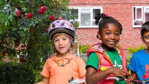 Apple Tree House production shot - three children on bikes