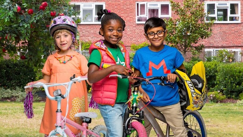 Apple Tree House production shot - three children on bikes